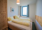 Inselblume 14 - Blaue Ferienwohnung mit Balkon am Südstrand