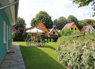 K 100 EG - stilvolle Ferienwohnung mit traumhaften Garten, Kinderspielplatz & Außenwhirlpool