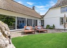 Inselblume 84 - Ferienhaus 'Reethus' mit Reetdach in Ostermarkelsdorf